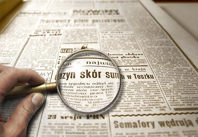 An image showcasing a magnifying glass hovering over a stack of financial documents, highlighting regulatory compliance priorities