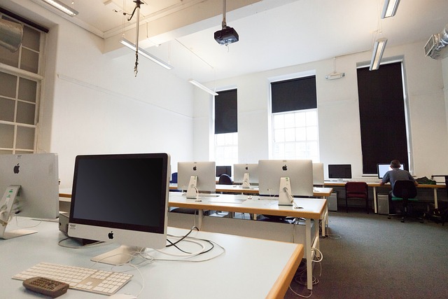 An image showcasing a bright, spacious study room with a large clock on the wall, displaying a convenient exam time